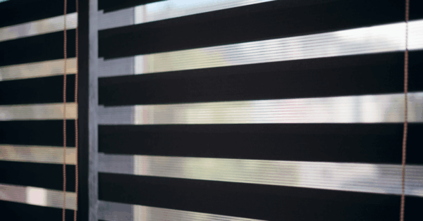 Choosing Between Blackout Shades and Room-Darkening Shades - Shaded Window Coverings