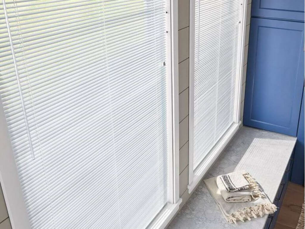 Known for their durability and resistance to humidity, aluminum blinds are a budget-friendly option that offers a sleek, minimalist look.