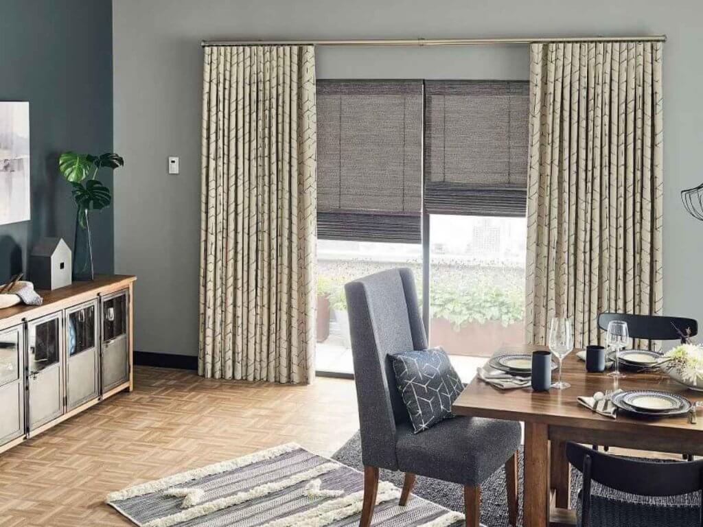 Gray Graber woven wood shades in a dining room window