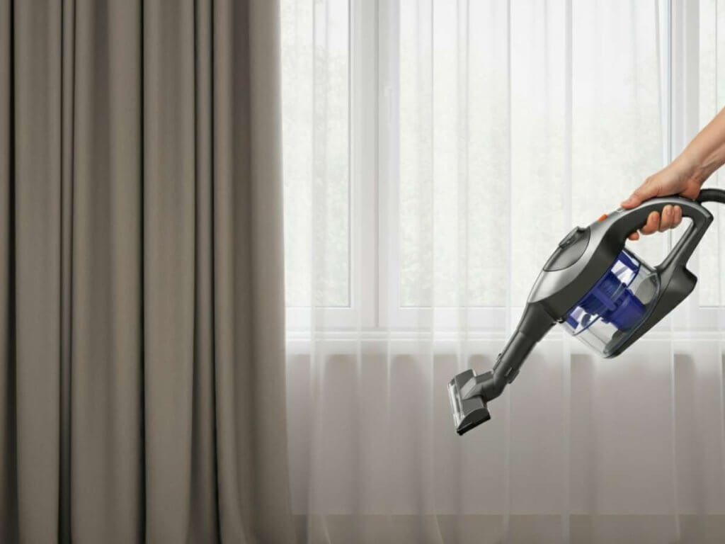 Vacuuming draperies