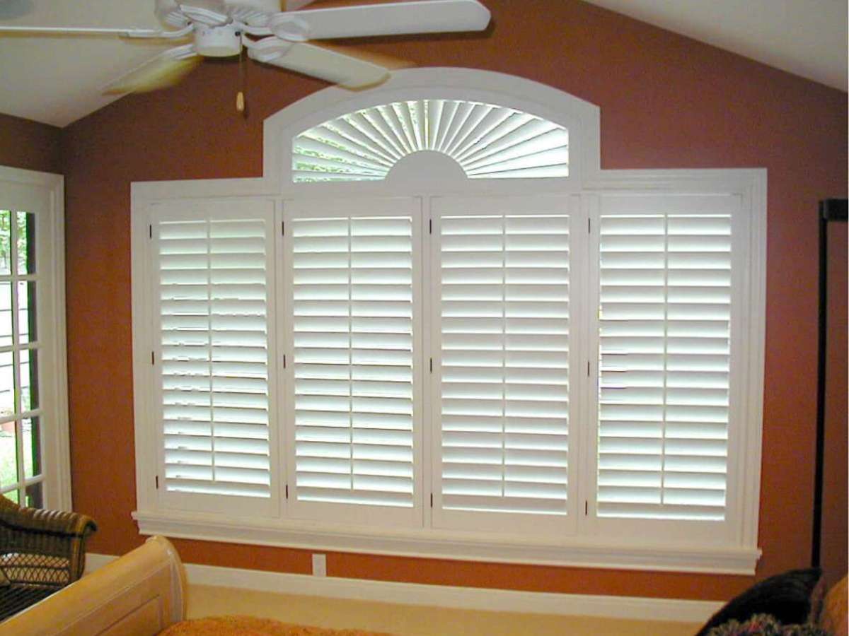Affordable faux wood shutters mimicking plantation shutter elegance